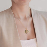 a woman wearing a necklace