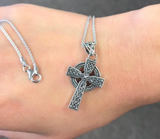 celtic cross necklace on hand