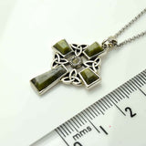 Connemara marble Celtic cross with trinity knot decoration.